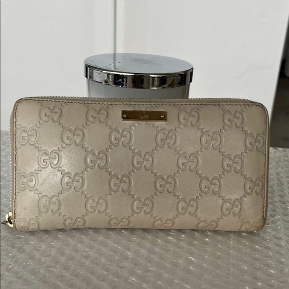 Gucci Vintage Monogram Embossed Leather Wallet